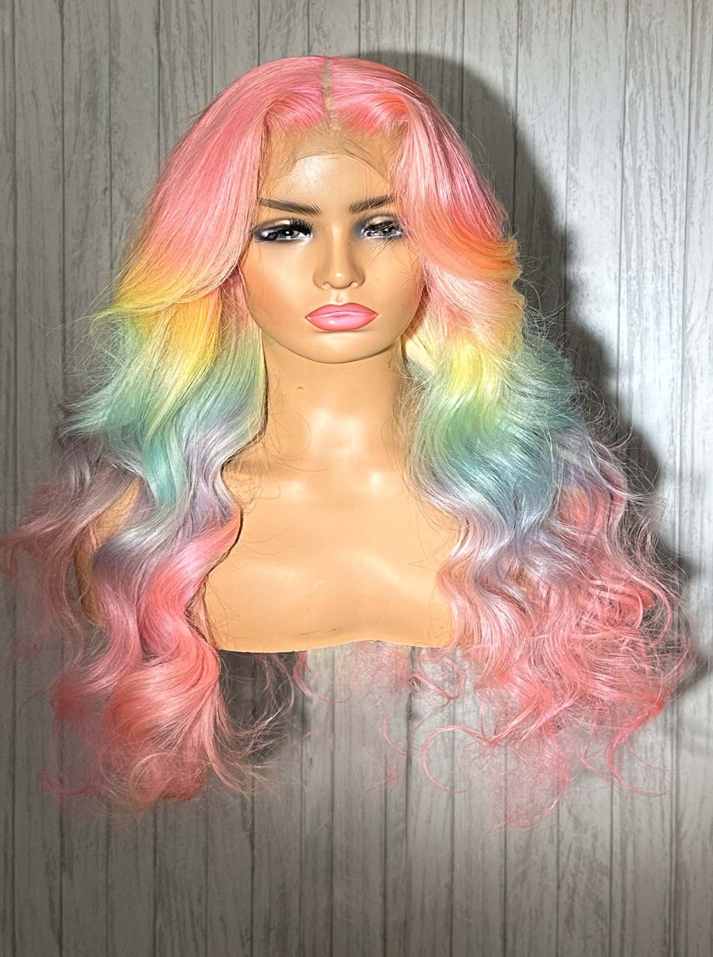Pastel rainbow wig with long loose waves, pink-to-green ombre highlights